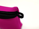 Close-up of pink Neoprene Beach Pouch showcasing the black finger loop for holding onto or attaching beach pouch to something.